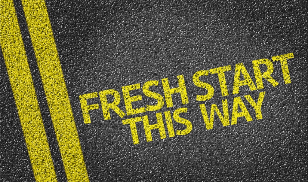 Road marking reading Fresh Start This Way