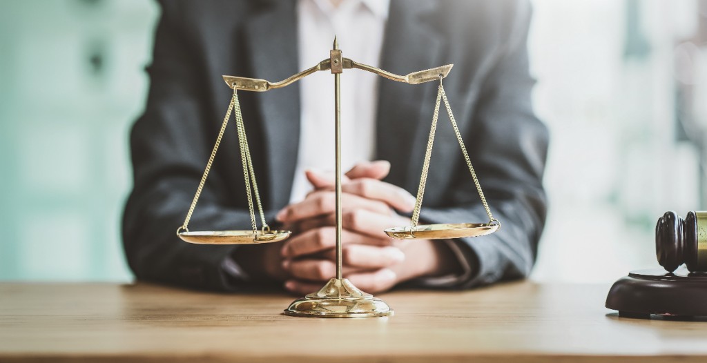 Scales of justice on a desk representing legal services